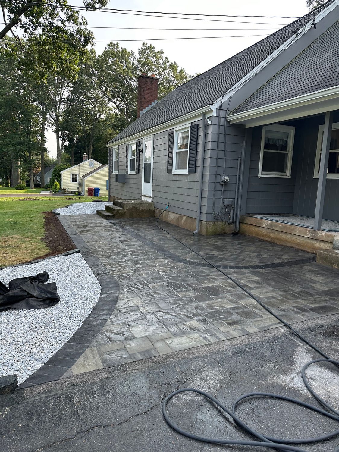 Backyard Paver Patio by TNT Masonry & Pavers in Connecticut