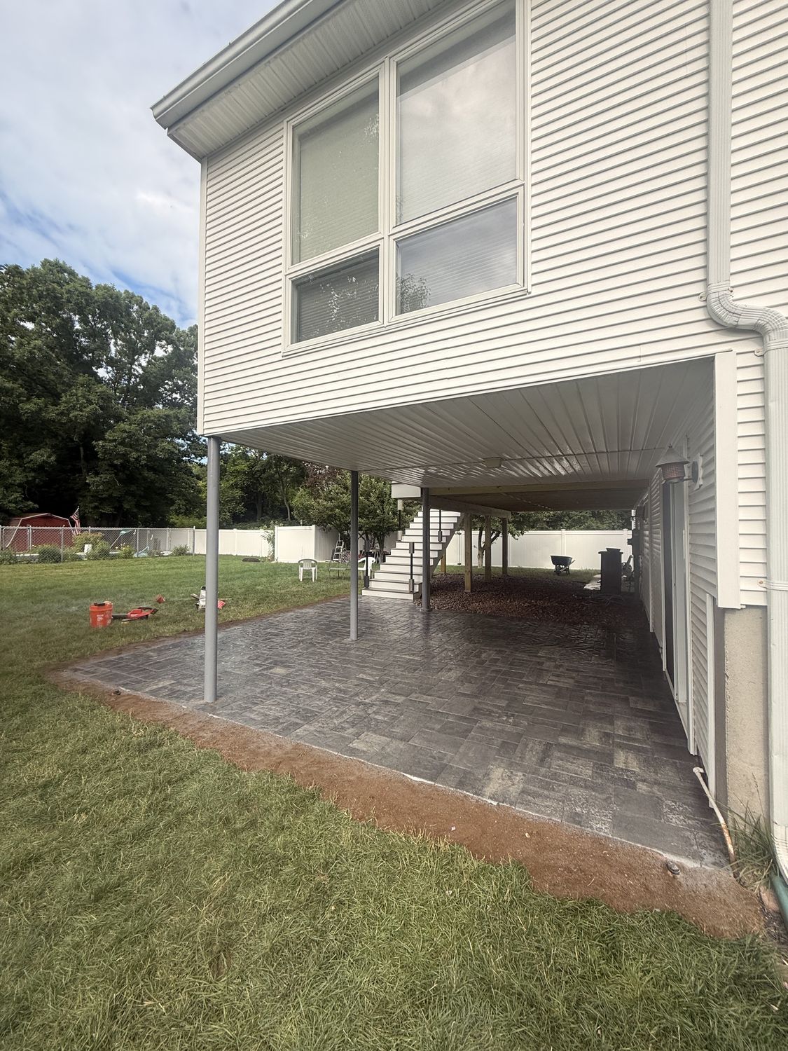 Under-Deck Paver Patio by TNT Masonry & Pavers in Connecticut
