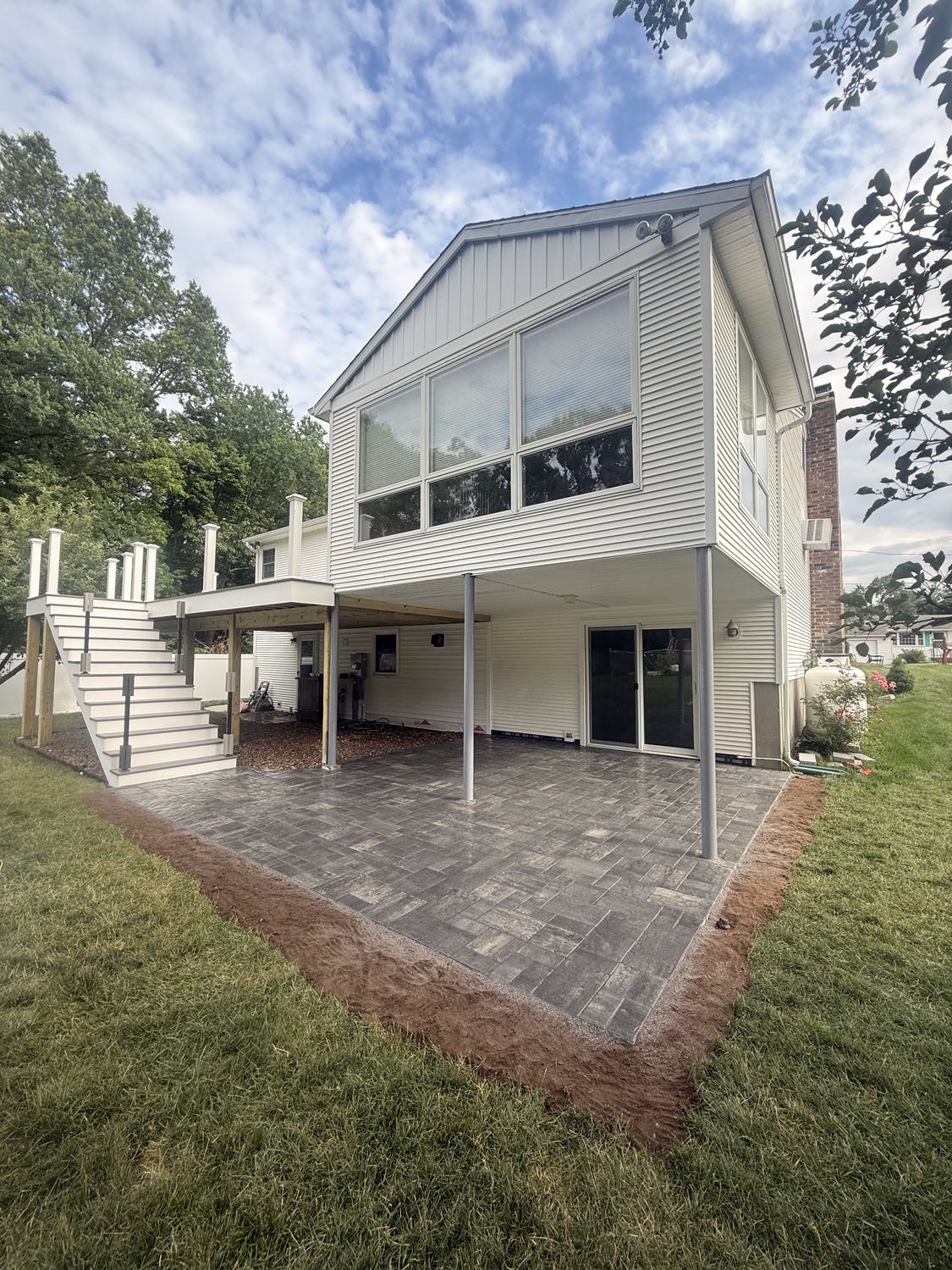 Walk-Out Paver Patio by TNT Masonry & Pavers in Connecticut