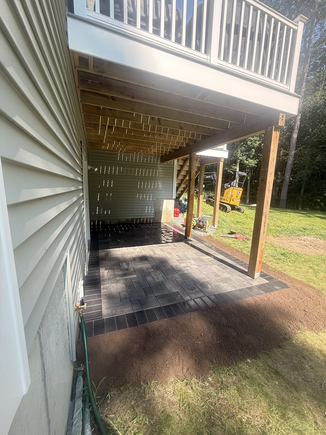 Covered Paver Patio by TNT Masonry & Pavers in Connecticut