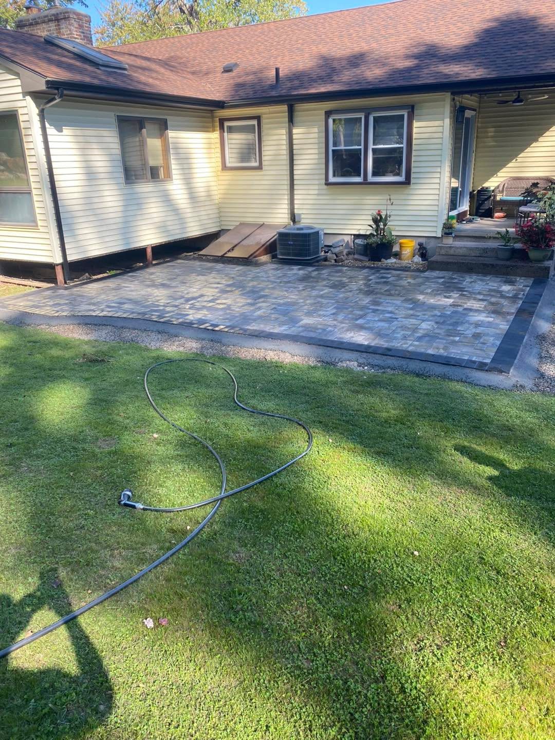 Backyard Paver Patio by TNT Masonry & Pavers in Connecticut